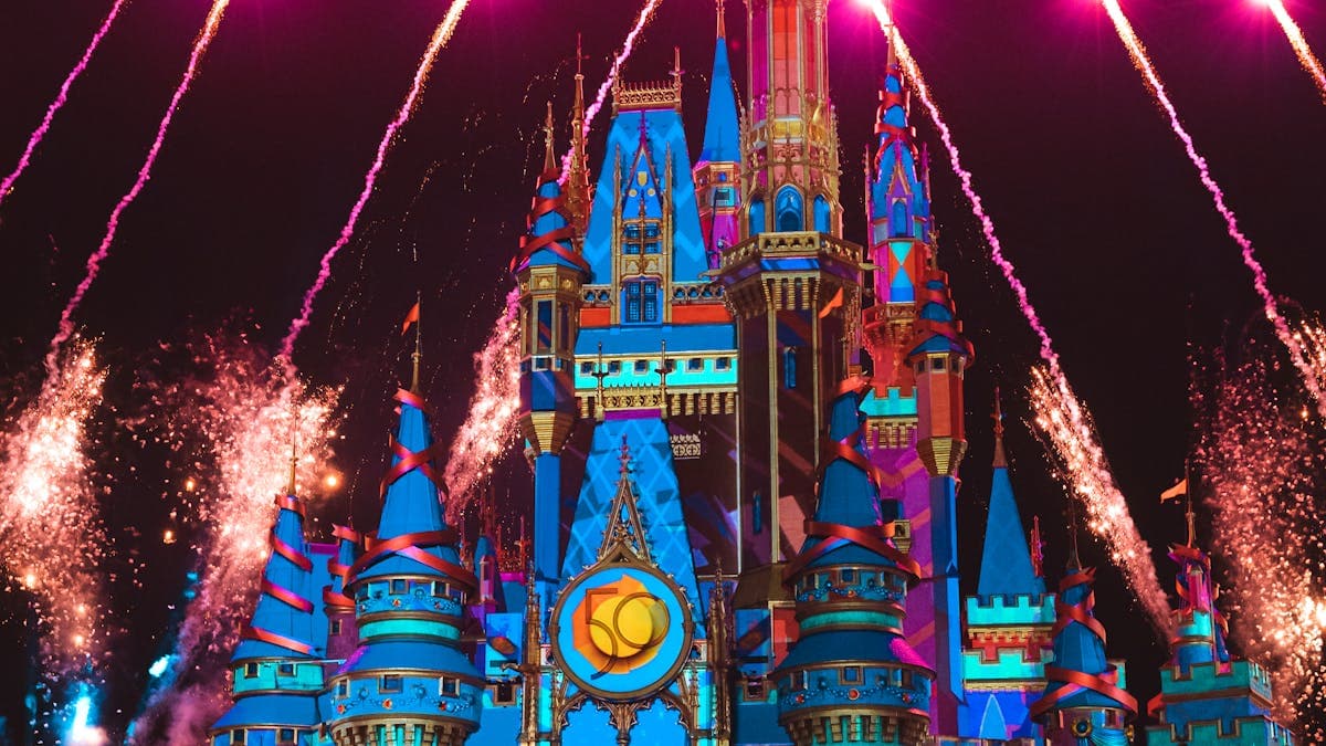 Fireworks lighting up the sky over Magic Kingdom castle at Walt Disney World in Orlando Florida