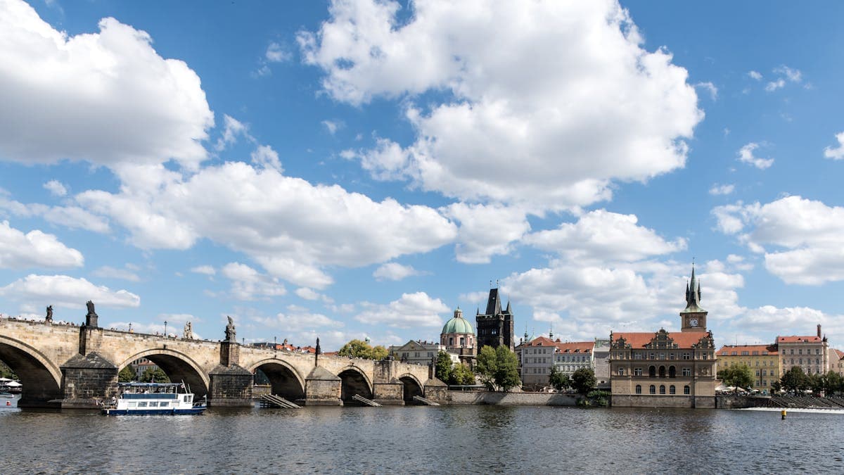 Stunning daytime view of Charles Bridge spanning the Vltava River in Prague, Czech Republic