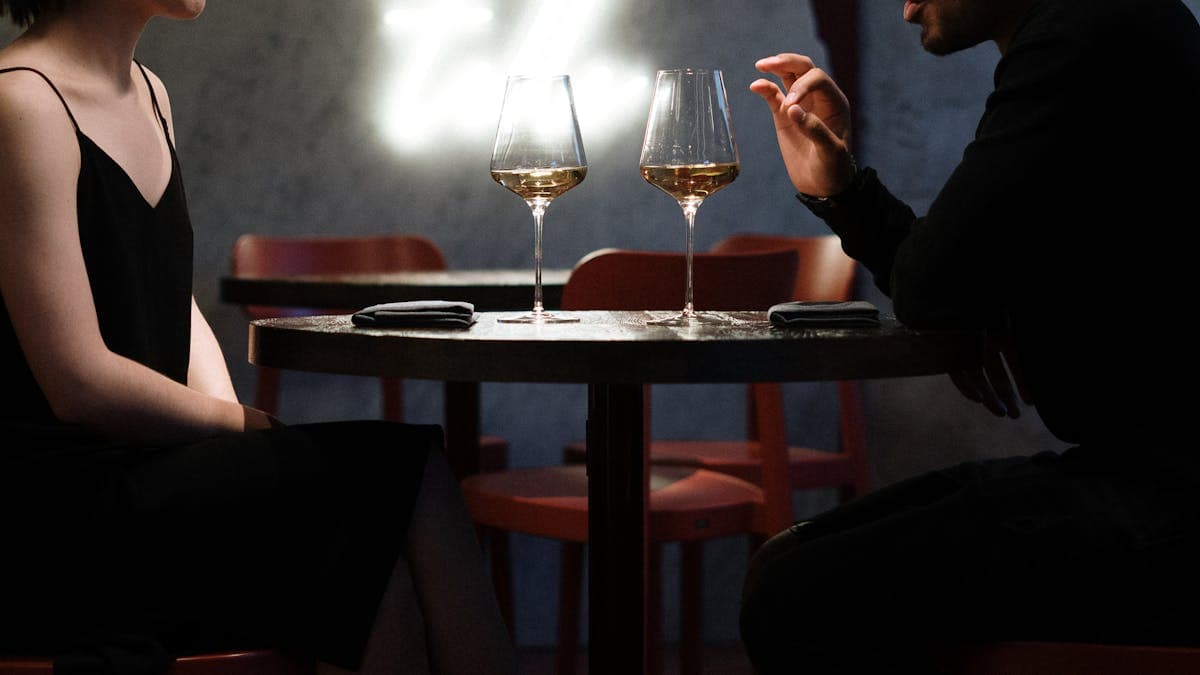 Couple enjoying a romantic dinner date at a stylish restaurant in Orlando